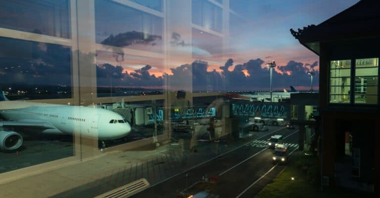Airport Transfer Blogs | Articles | News | Tips & Tricks | Video | FAQ | Information | Infograph. 34 Through glass modern aircraft parked near airbridge in contemporary airport against picturesque dusk sky