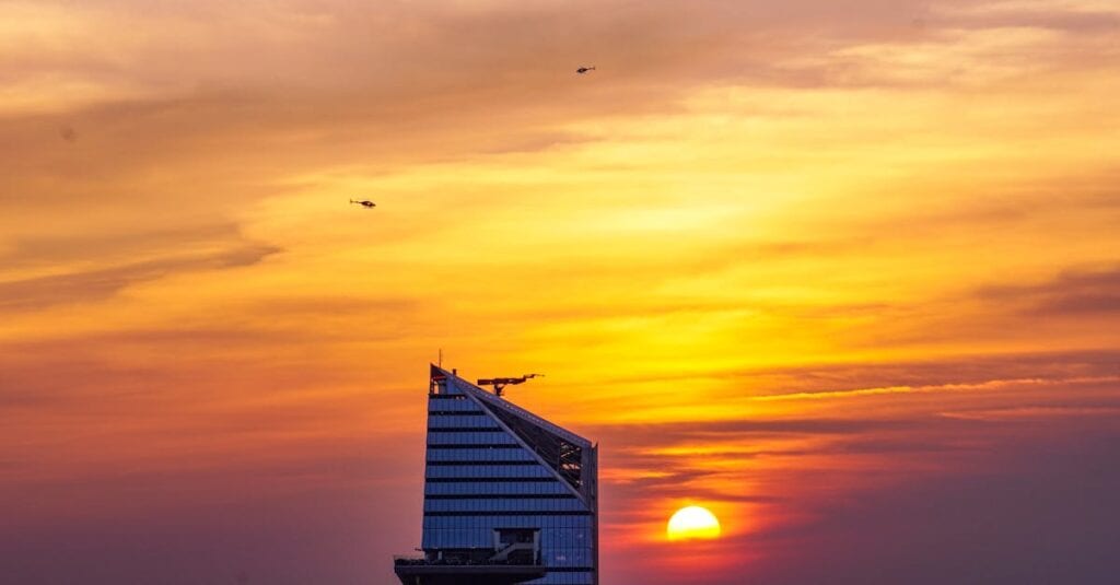 Helicopters soar past a skyscraper during sunset in New York City.