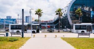 Contemporary cityscape with buses at a transportation hub in Sochi, Russia.