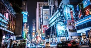 Experience the bustling city life of Times Square, New York City, captured at night in vivid colors and lights.
