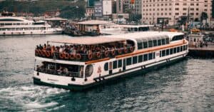 A bustling ferry filled with passengers at Istanbul's vibrant terminal, capturing the essence of city travel.