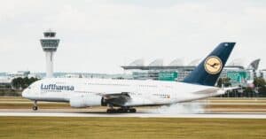 Lufthansa Airbus A380 landing at Munich Airport, showcasing aviation dynamics.