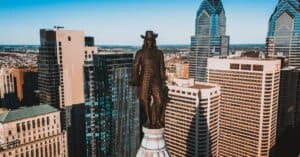 Drone view of monument of William Penn located on top of high tower in Philadelphia
