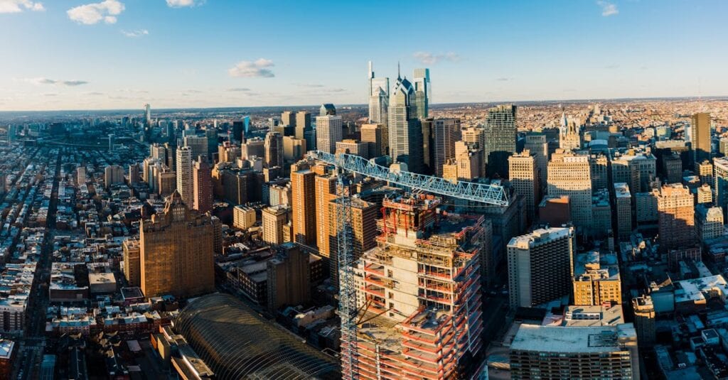 Stunning aerial shot of Philadelphia's skyline featuring modern skyscrapers, under a clear blue sky.