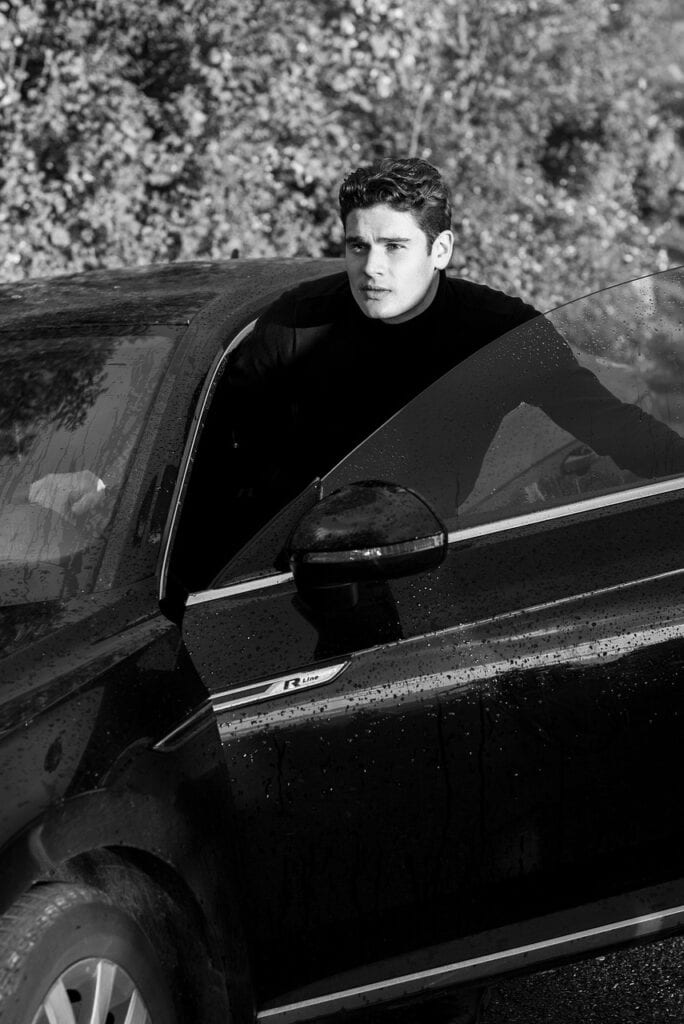 Luxury JetBlack sedan providing a smooth way to transfer from JFK to LGA airport, featuring a professional driver and passengers with luggage heading toward East Elmhurst in NYC, 2025