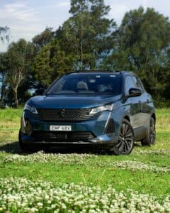 Stylish black SUV parked on a lush green field in Wollongong, Australia.