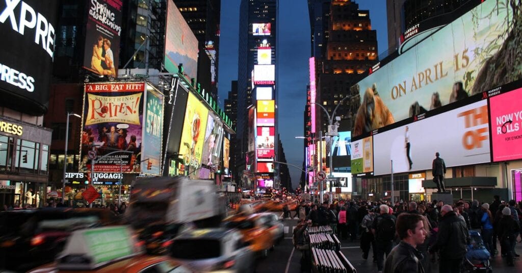 Dynamic night scene capturing the bustling energy and iconic billboards of Times Square, New York City.