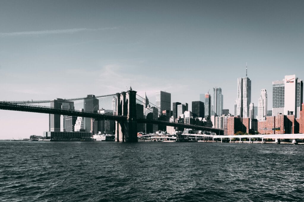 Iconic Brooklyn Bridge with Manhattan skyline on a clear day.