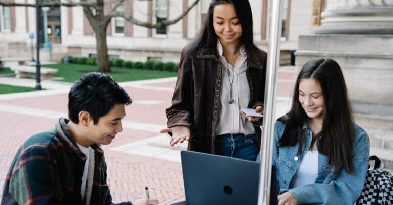 Airport Transfer Blogs | Articles | News | Tips & Tricks | Video | FAQ | Information | Infograph. 3 Group of university students collaborating and studying together in an outdoor setting.