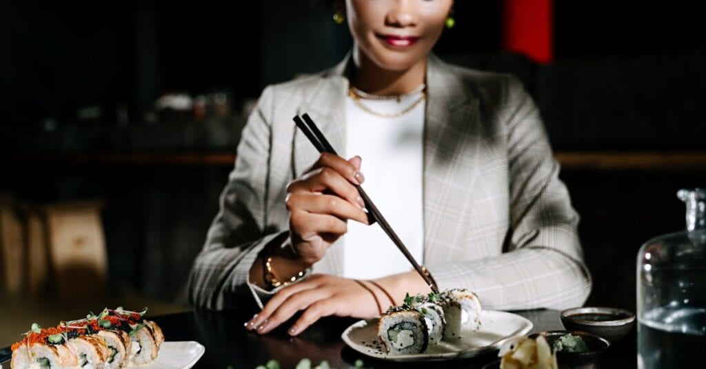 A woman dining indoors, enjoying sushi with chopsticks, creating an elegant and modern atmosphere.