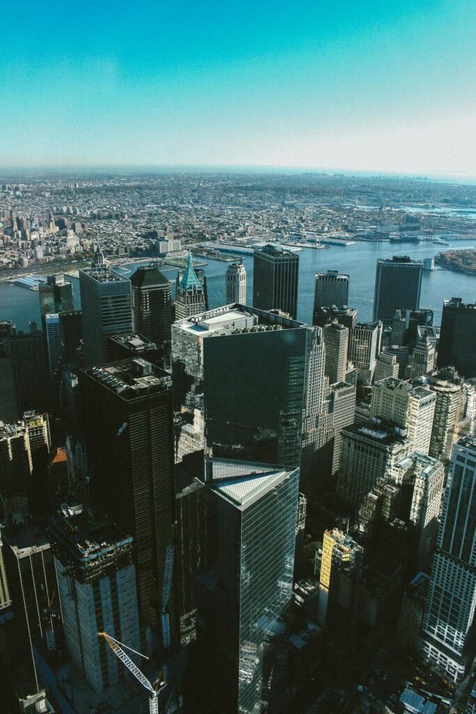 Stunning aerial view of New York City's iconic skyline with skyscrapers and rivers.