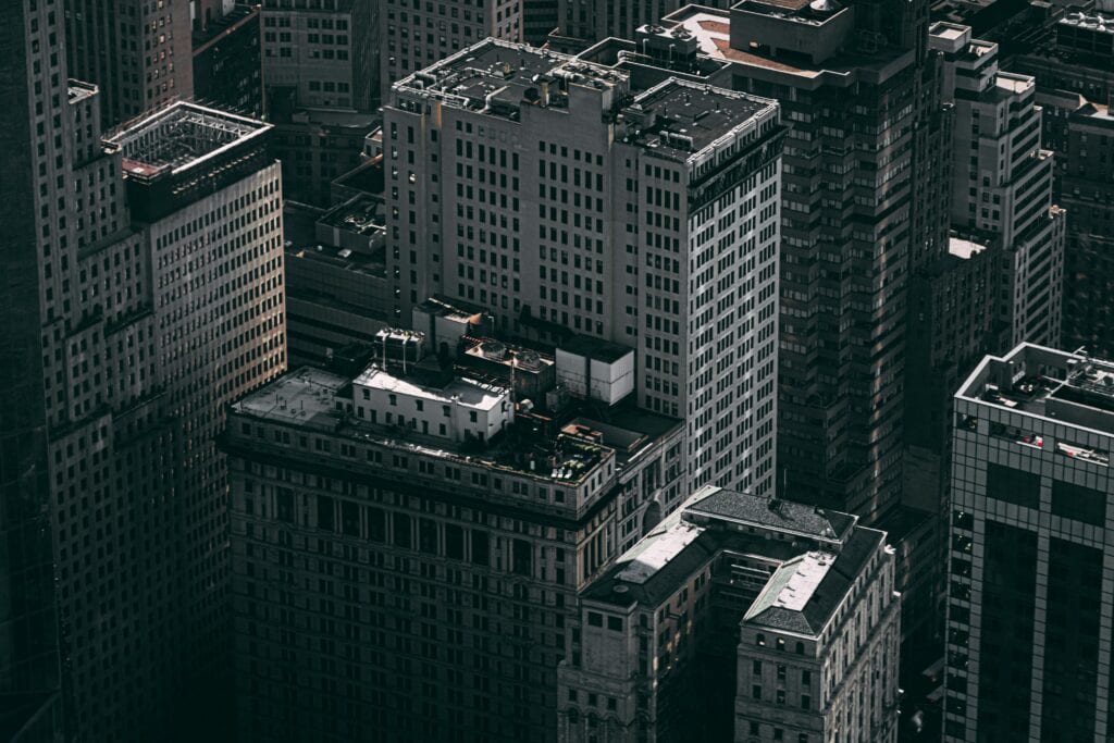 Dramatic aerial view of Manhattan skyscrapers showcasing urban architectural design.