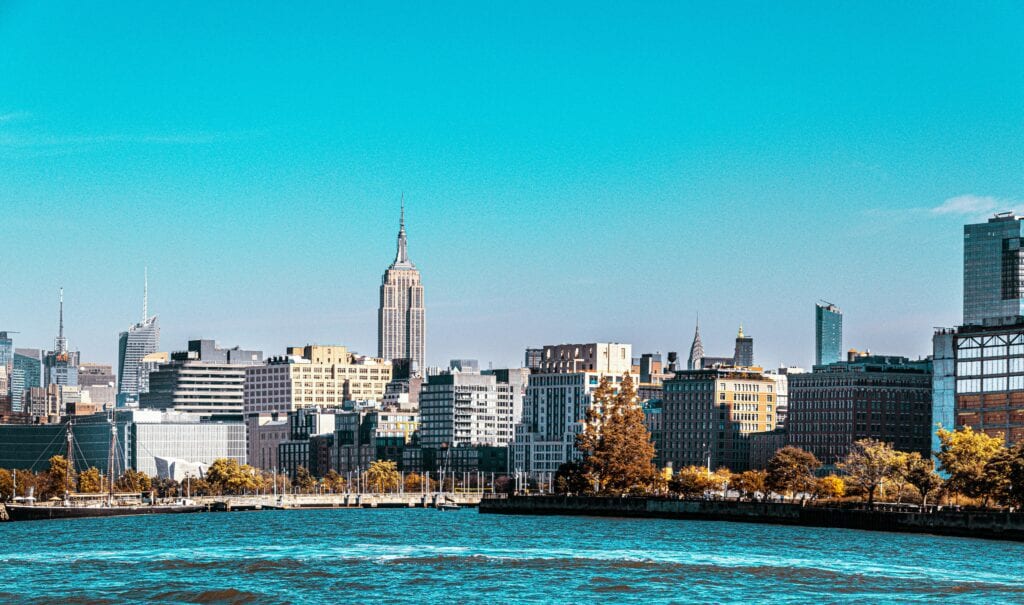 A stunning daytime view of New York City's skyline featuring the iconic Empire State Building.