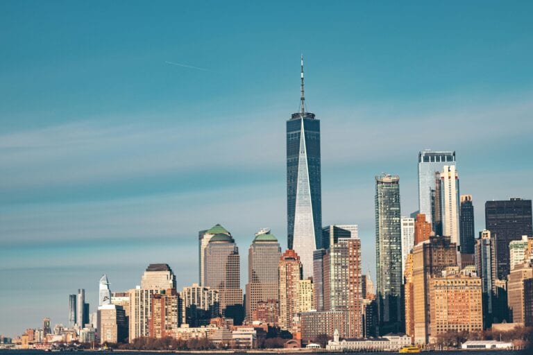 Stunning view of New York City skyline with One World Trade Center and modern architecture.