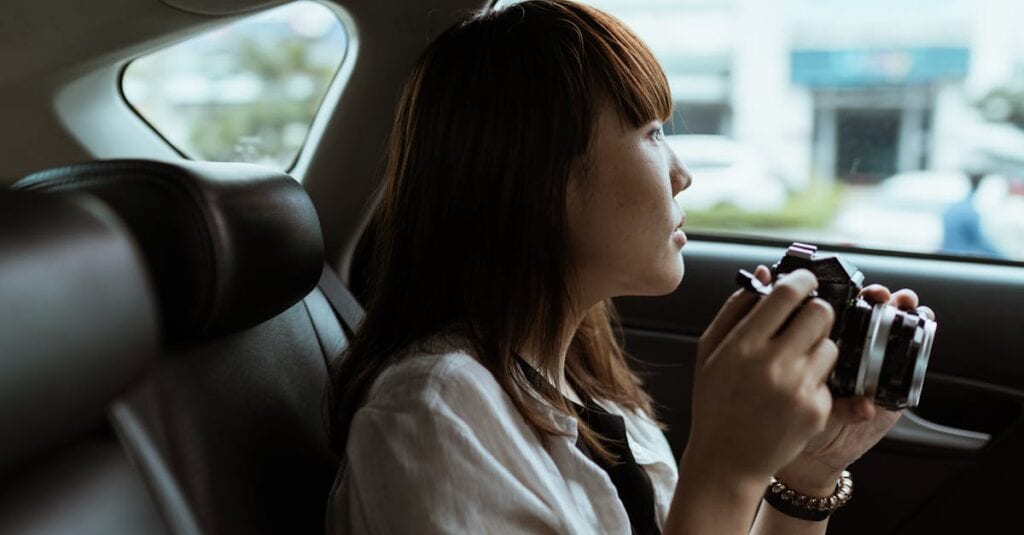 GO Airlink van for shuttle bus LaGuardia waits curbside at LGA, handling luggage, 2025.