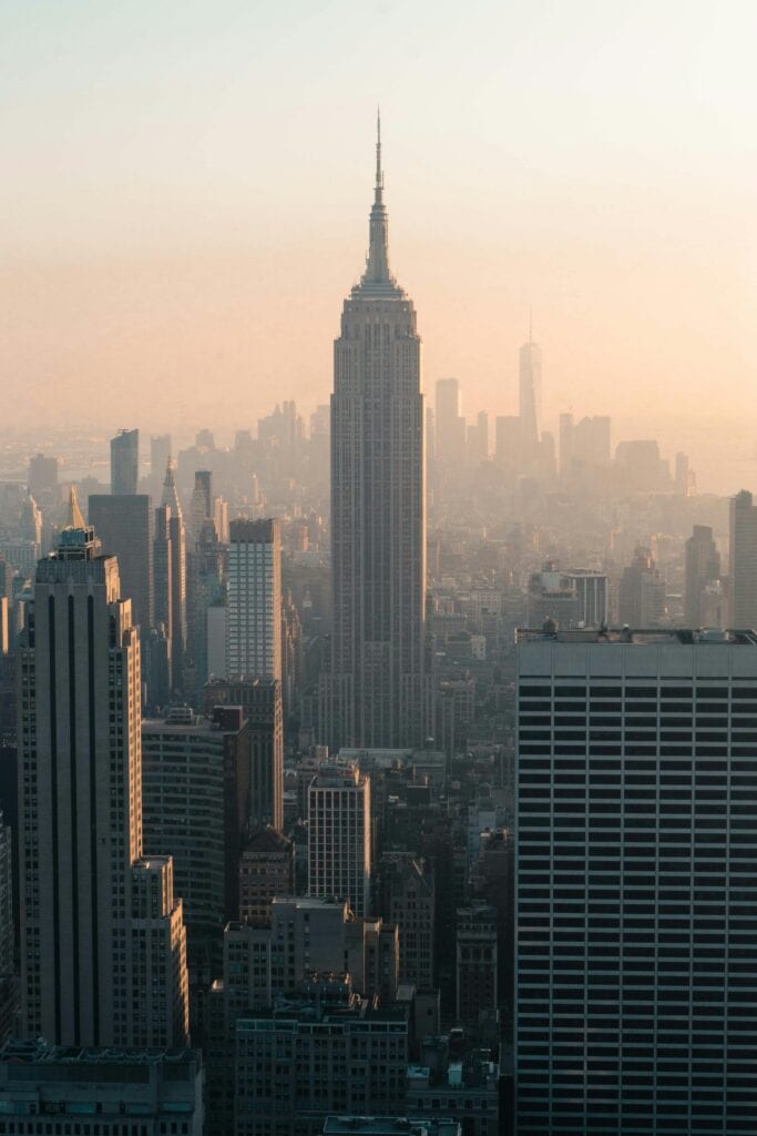 Stunning view of New York skyline featuring the Empire State Building at sunset.