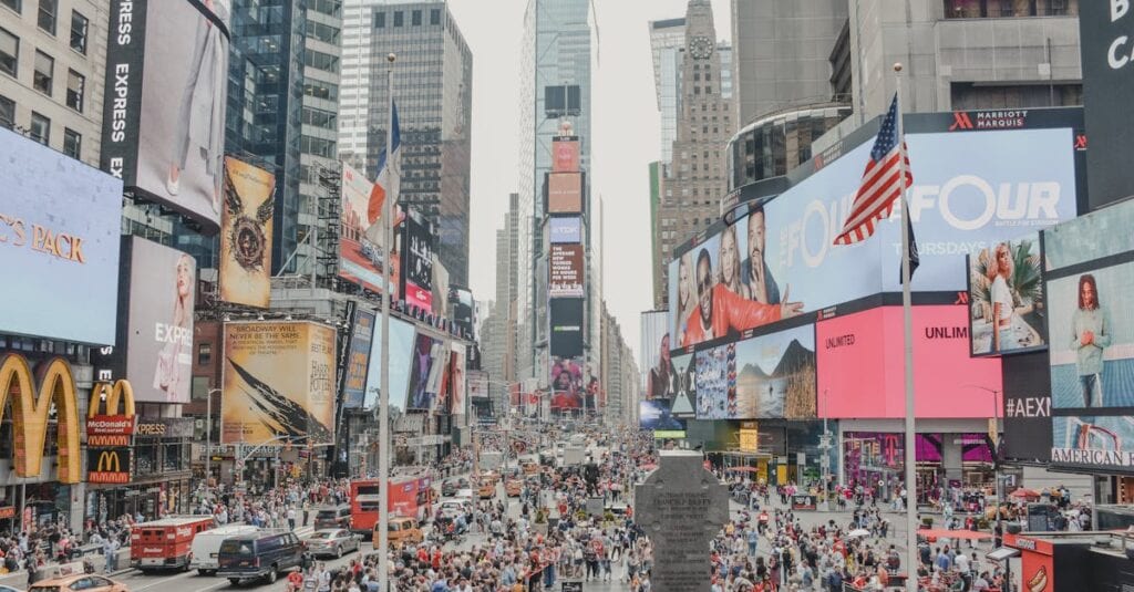 Vibrant Times Square filled with people, advertisements, and skyscrapers in New York City.