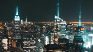 A breathtaking view of New York City's illuminated skyline featuring iconic skyscrapers.