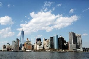 Stunning view of New York City's skyline featuring iconic skyscrapers against a blue sky.