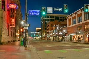 Illuminated downtown Idaho street showcasing vibrant nightlife and charming architecture.