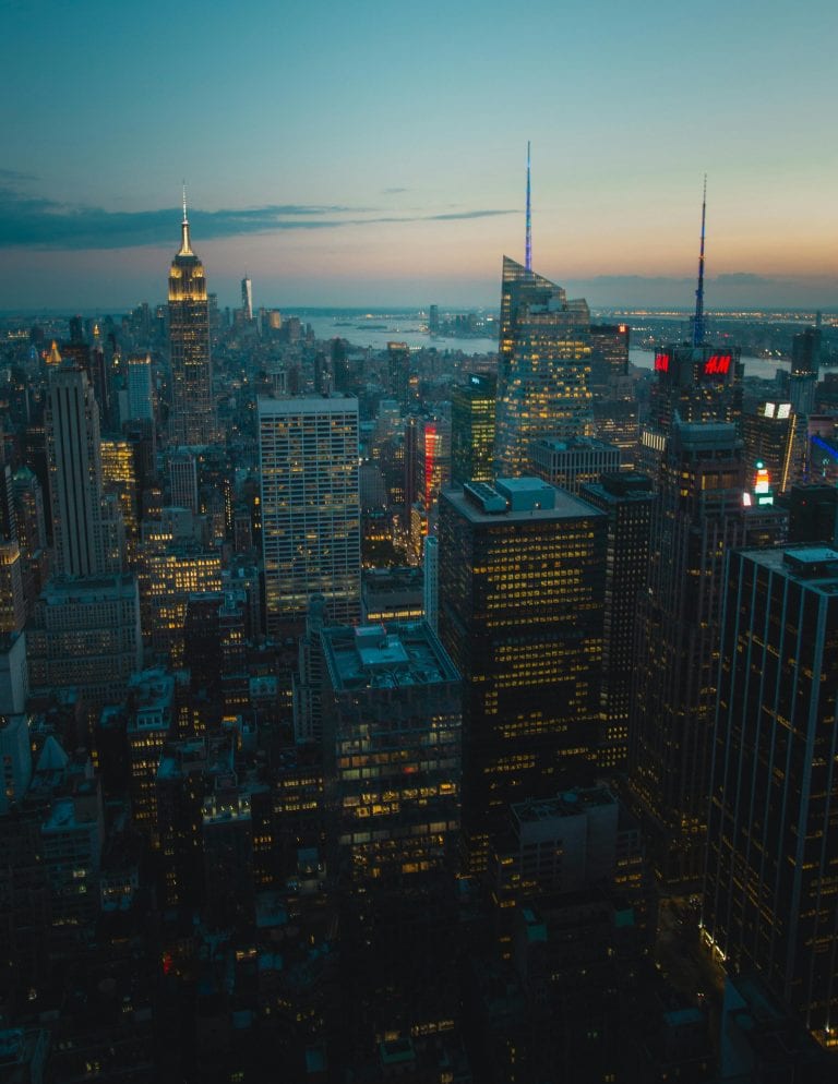 A breathtaking view of New York City's skyline at dusk, showcasing iconic skyscrapers and city lights.