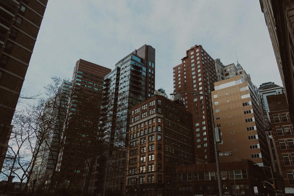 View of modern skyscrapers in downtown New York City, showcasing diverse architectural styles.