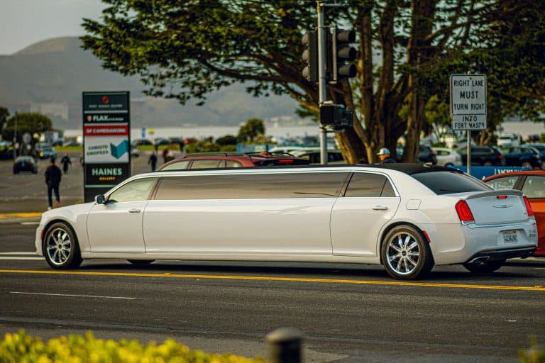 Car Service Blogs | Articles | News | Tips & Tricks | Video | FAQ | Information | Infograph. 24 A white limousine driving on a street in San Francisco with a scenic background.