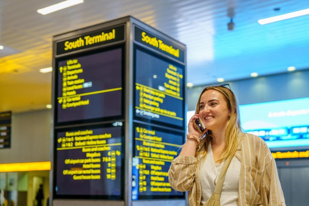 reliable airport pickup JFK black sedan at JFK arrivals kerb Queens New York