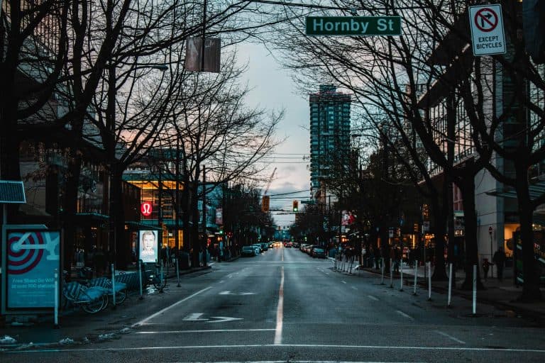 Car Service Blogs | Articles | News | Tips & Tricks | Video | FAQ | Information | Infograph. 19 Nighttime urban street view of Hornby Street in downtown Vancouver, showcasing city life.