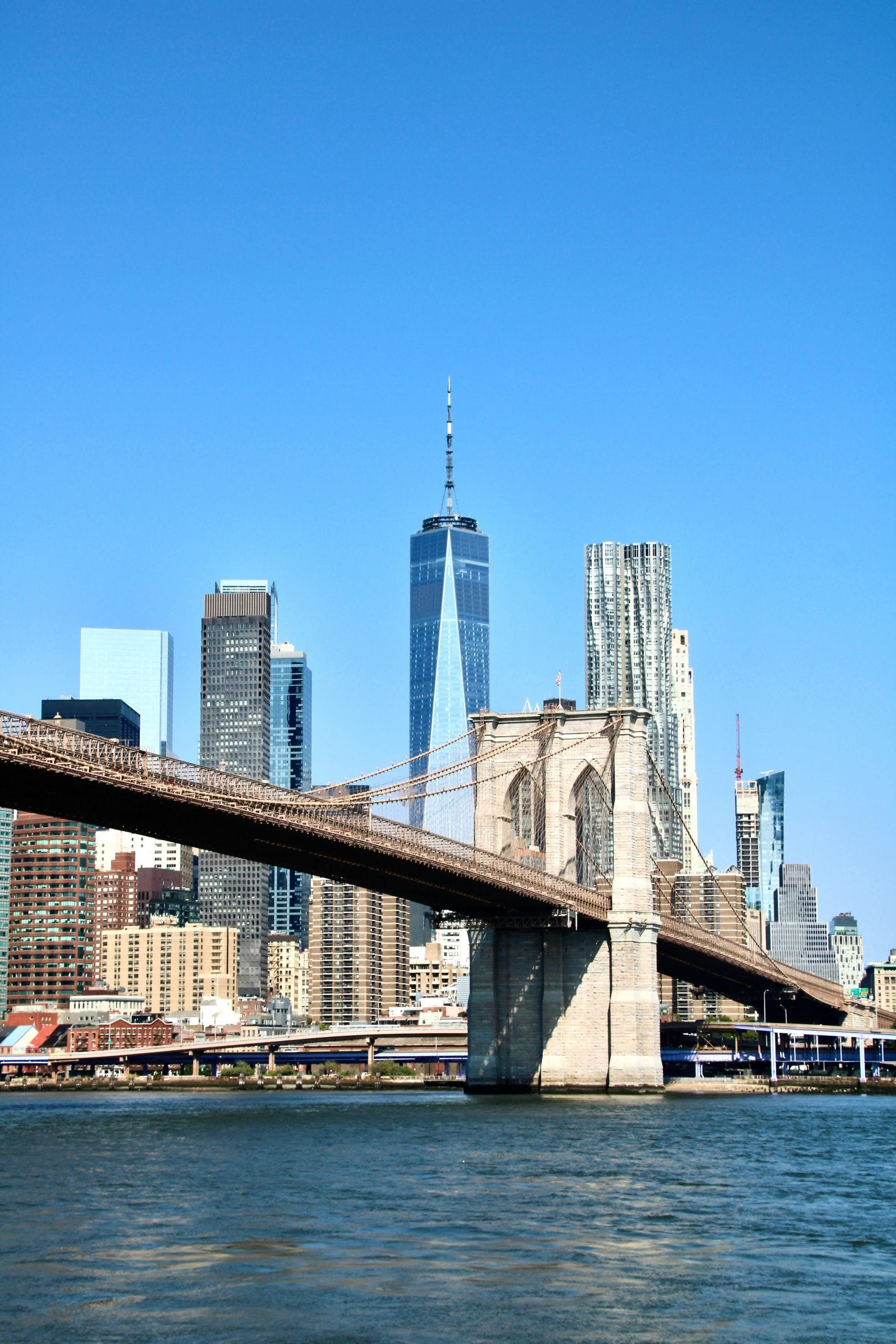 Iconic Brooklyn Bridge and New York City skyline captured on a clear day.