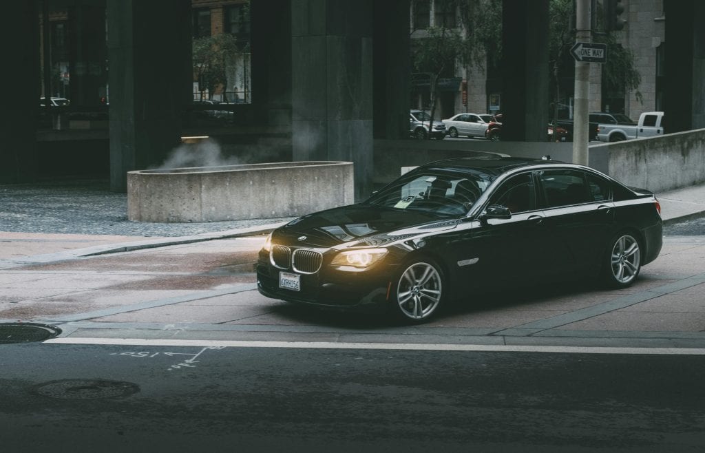 Limo Service from LaGuardia Reviews 2026: Honest Traveler Feedback on NYC Airport Transfers That Actually Deliver 19 A luxury black car navigating city streets at twilight, showcasing modern city life and design.
