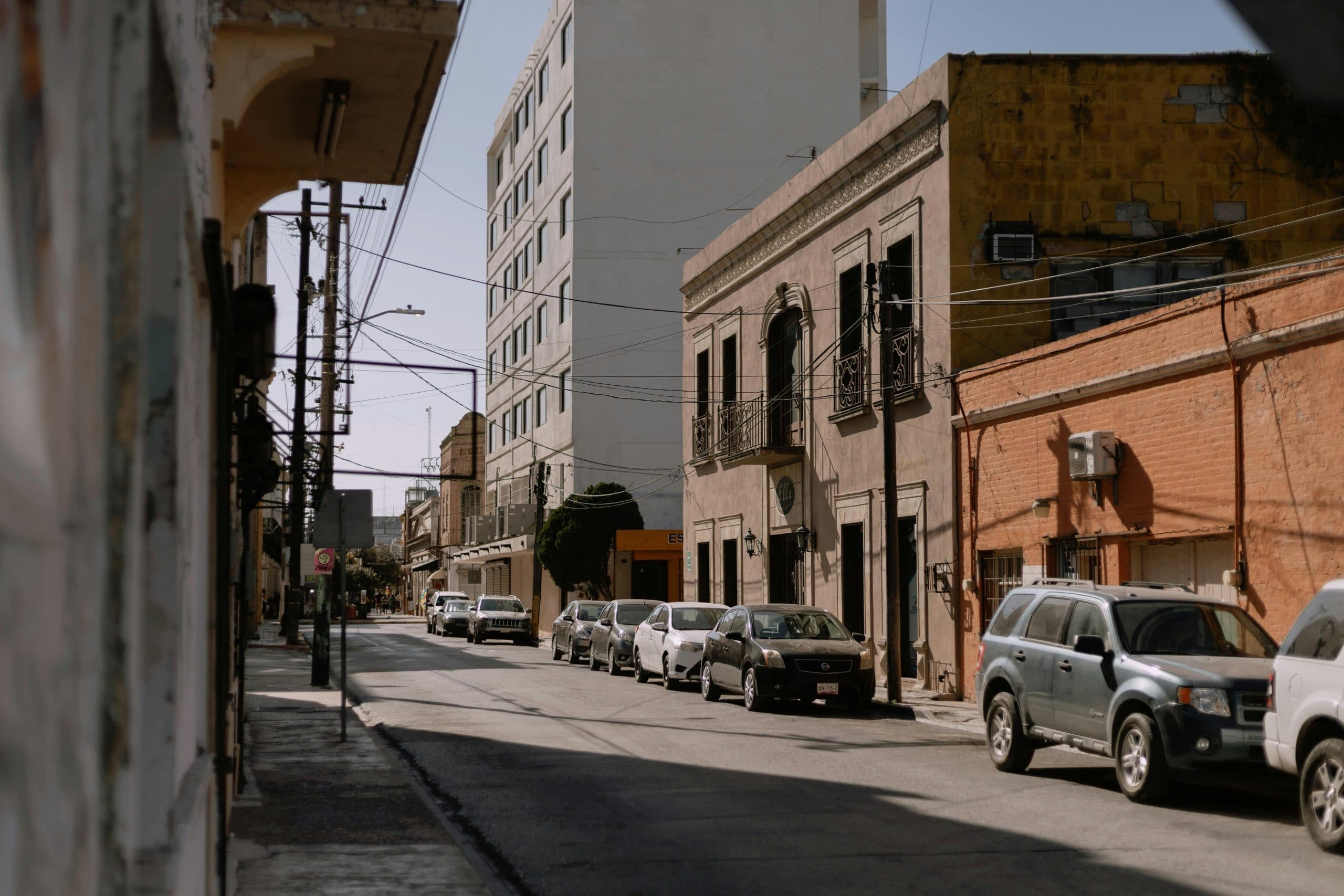 Charming architectural street view in Heroica Matamoros, Mexico, showcasing colonial buildings and urban life.