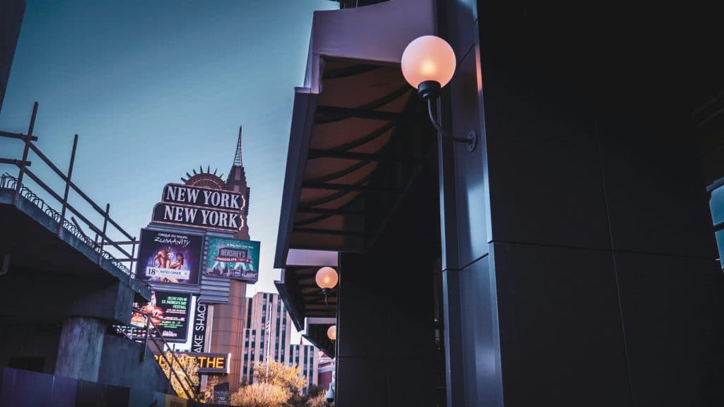 Luxury New York City Town Car Service: 6 Honest Facts for 2026 13 Captivating shot of the New York-New York sign in Las Vegas at twilight, featuring glowing lights and urban architecture.