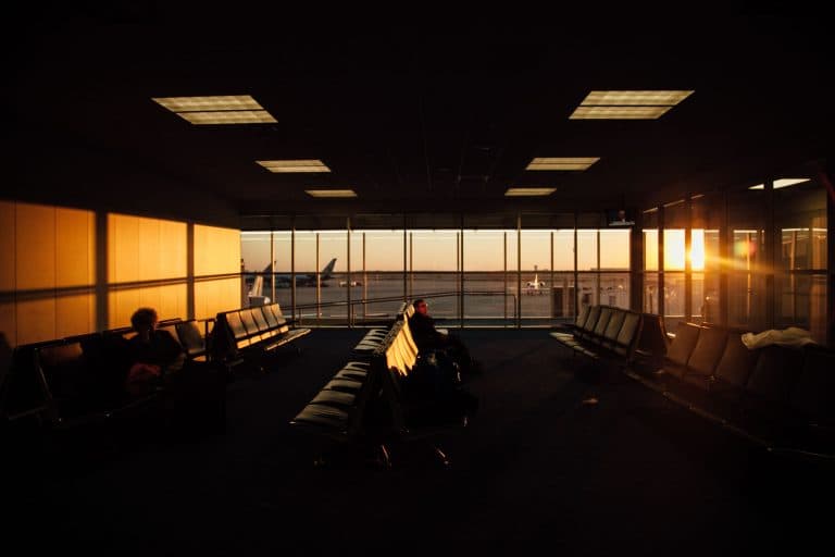 Car Service Blogs | Articles | News | Tips & Tricks | Video | FAQ | Information | Infograph. 46 Peaceful airport waiting area with sunset silhouettes and quiet ambiance.