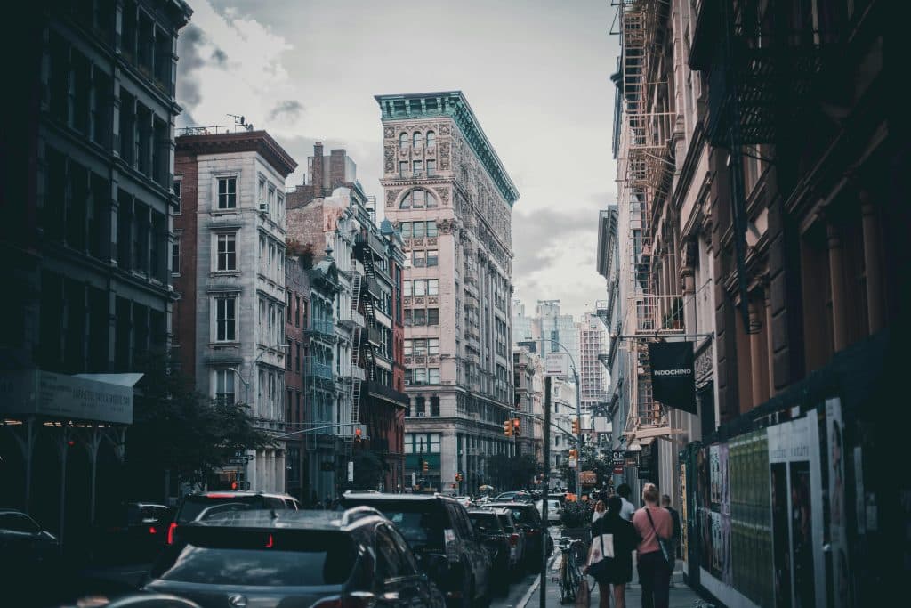 Urban scene capturing traffic and pedestrians in historic Soho, NYC.