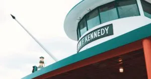 Low angle view of John F. Kennedy ferry exterior on a cloudy day, New York City.