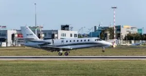 A private jet touches down at Prague International Airport, capturing a moment of travel luxury and sophistication.