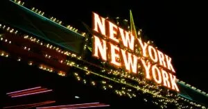 Bright neon lights of the New York New York sign glowing at night in vibrant colors.