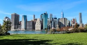 Captivating view of the Manhattan skyline taken from a green park in Brooklyn, New York City.