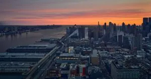 New York City skyline with vibrant sunset over the Hudson River