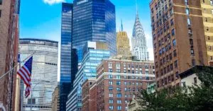 Stunning view of Midtown Manhattan skyscrapers including the Chrysler Building under a blue sky.
