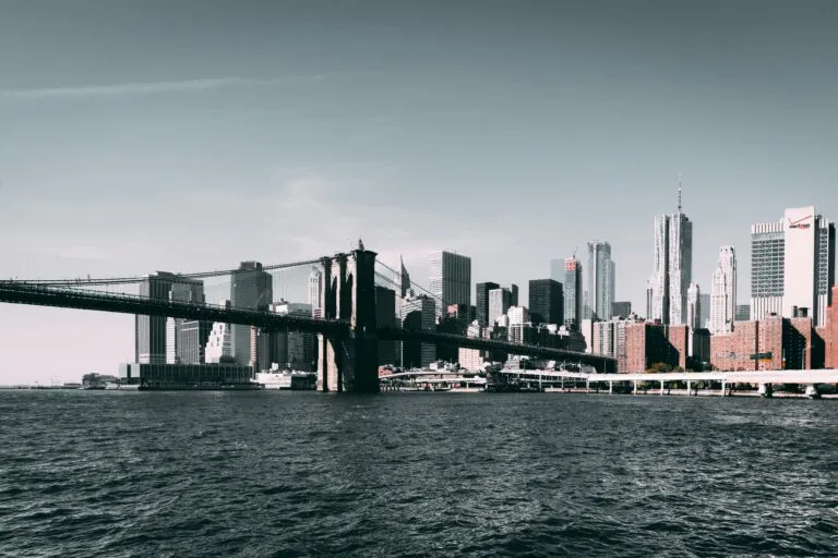 Iconic Brooklyn Bridge with Manhattan skyline on a clear day.