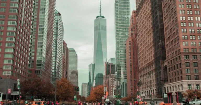 Vibrant cityscape of downtown New York City featuring the iconic One World Trade Center.